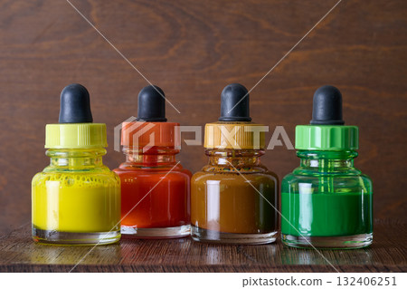 watercolor paint pot on wooden plank watercolor paint pot on wooden plank 132406251