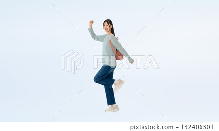 Full-body photo of a running female student Full-body photo of a running female student 132406301