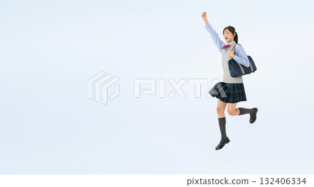 Full-body photo of a jumping female student in uniform Full-body photo of a jumping female student in uniform 132406334