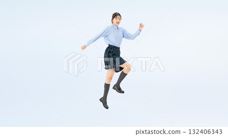 Full-body photo of a jumping female student in uniform Full-body photo of a jumping female student in uniform 132406343