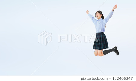 Full-body photo of a jumping female student in uniform 132406347
