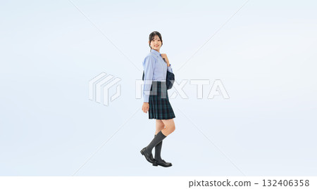 Full-body photo of a walking female student in uniform Full-body photo of a walking female student in uniform 132406358