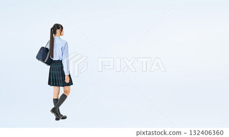 Full-body photo of a walking female student in uniform 132406360