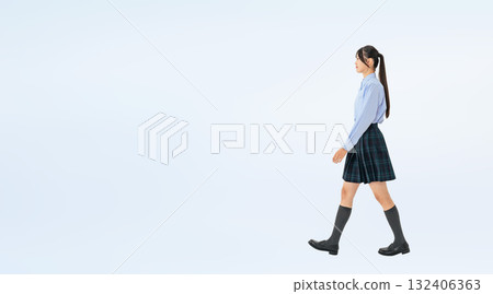 Full-body photo of a walking female student in uniform 132406363