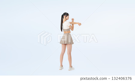Full-body photo of a woman in sportswear stretching 132406376
