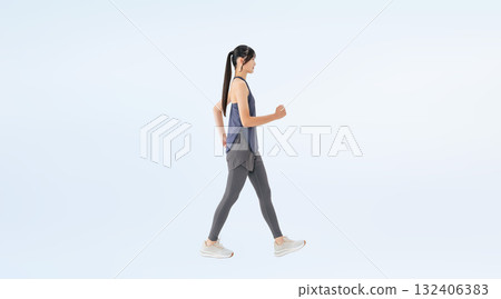 Full-body photo of a woman in sportswear walking Full-body photo of a woman in sportswear walking 132406383