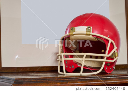 Red american football helmet on furniture Red american football helmet on furniture 132406448