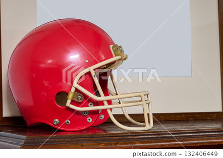 Red american football helmet on furniture Red american football helmet on furniture 132406449