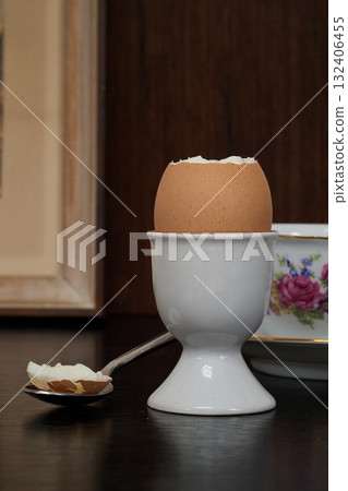 an egg in its egg cup for morning breakfast 132406455