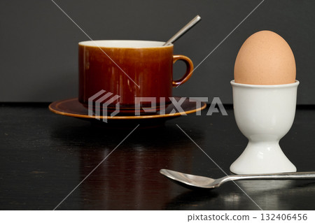 an egg in its egg cup for morning breakfast 132406456