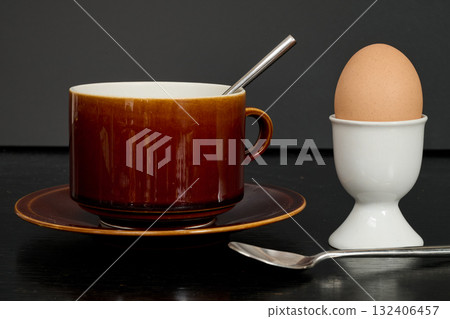 an egg in its egg cup for morning breakfast 132406457