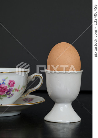 an egg in its egg cup for morning breakfast 132406459