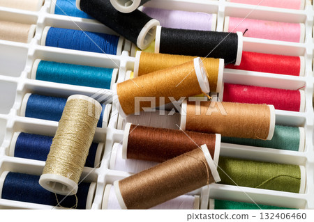 spools of multicolored sewing thread spools of multicolored sewing thread 132406460