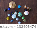 Marble game on wooden support 132406474