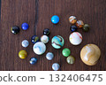 Marble game on wooden support 132406475