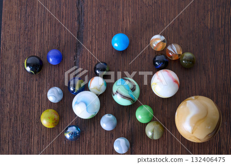 Marble game on wooden support Marble game on wooden support 132406475