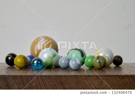 Marble game on wooden support Marble game on wooden support 132406478