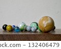 Marble game on wooden support 132406479