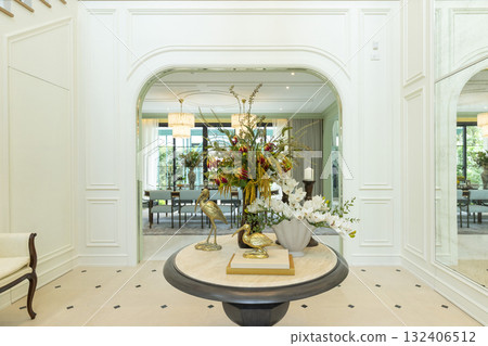 Foyer space with reception console in new luxury home with staircase. 132406512