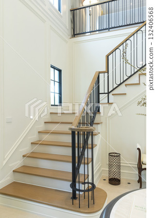 Luxury home interior white walls and a white staircase. 132406568