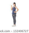 A woman in sportswear pumping her fist - Full-body photo PNG with transparent background, precisely cut out by hand 132406727