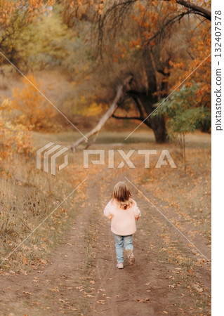 Family Walking With Pet Golden Retriever Dog Along Autumn Woodland Path Together 132407578