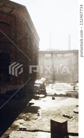 A vertical shot of a dirty street with a brick building in the foreground and a bridge in the background, showcasing urban decay, vertical A vertical shot of a dirty street with a brick building in the foreground and a bridge in the background, showcasing urban decay, vertical 132407734