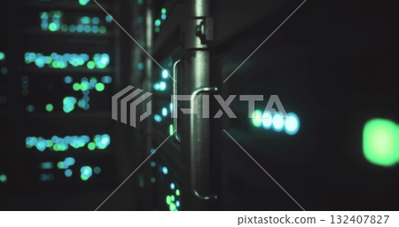 Colorful lights flicker from server racks in a data center, showcasing advanced technology. The environment is dimly lit, emphasizing the vibrant green and blue hues while equipment hums softly. Colorful lights flicker from server racks in a data center, showcasing advanced technology. The environment is dimly lit, emphasizing the vibrant green and blue hues while equipment hums softly. 132407827