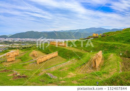 The view of rice terraces and Zenkoji Plain [Obasute Rice Terraces] 132407844