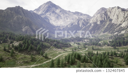 Majestic mountains rise in the background, surrounded by lush greenery and a winding path. This serene scene captures the beauty of nature with soft clouds overhead and vibrant flora. 132407845