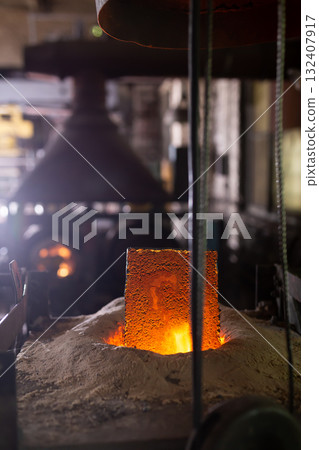 Foundry ferrous metal is melted in an induction furnace of metallurgical plant Foundry ferrous metal is melted in an induction furnace of metallurgical plant 132407917