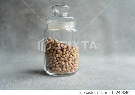 Glass jar with raw chickpeas Glass jar with raw chickpeas 132408402