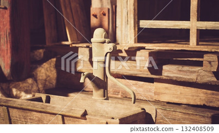 A vintage wooden water pump stands beside a rustic cabin, surrounded by timber walls and a warm sunshine, evoking a nostalgic countryside atmosphere. 132408509