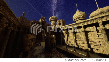 Ancient architectural ruins stand in a quiet desert at night, surrounded by a clear starry sky. The intricate stone carvings reflect historical craftsmanship and culture. 132408551