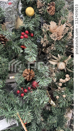 Christmas wreath with pinecones, berries, and ornaments for festive decoration background 132409053
