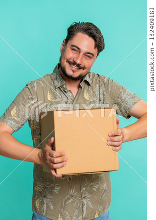 Man hugging cardboard delivery box happy smile expressing excitement about received online package 132409181