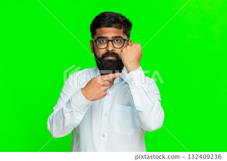 Indian man clenching fist in front showing power threat determination strong gesture chroma key 132409236