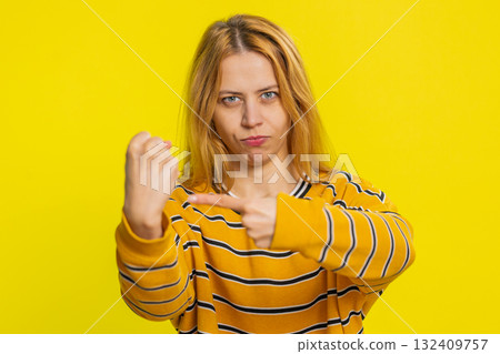 Aggressive angry woman trying to fight at camera, shaking fist, boxing, punishment, threaten Aggressive angry woman trying to fight at camera, shaking fist, boxing, punishment, threaten 132409757