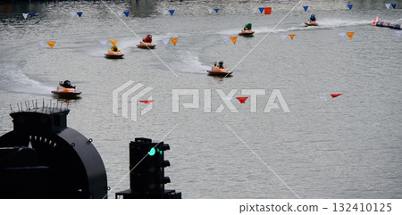 Racing boat splashing water 132410125
