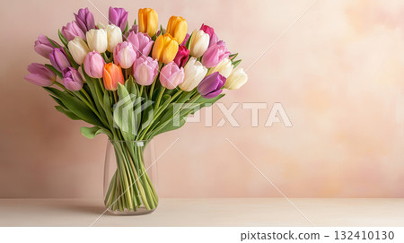 Colorful tulips in glass vase on yellow background with minimal style 132410130