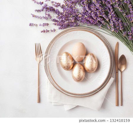 Happy Easter. Elegant top view, layout, minimalist style, Easter decorated table with golden eggs and lavender bouquet arranged on napkin with matching cutlery and glassware. Happy Easter. Elegant top view, layout, minimalist style, Easter decorated table with golden eggs and lavender bouquet arranged on napkin with matching cutlery and glassware. 132410159