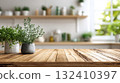 Fresh herbs in ceramic pots on a wooden kitchen table 132410397