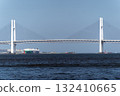 Yokohama Bay Bridge, a white bridge spanning the bay under a blue sky 132410665