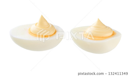 Half a boiled chicken egg with mayonnaise isolated on a white background. 132411349