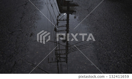 Electric pole in a puddle Electric pole in a puddle 132411659