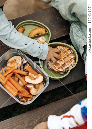 Healthy Kids Lunch Box Outdoors. Food snacks for children on the street. Healthy Kids Lunch Box Outdoors. Food snacks for children on the street. 132411974