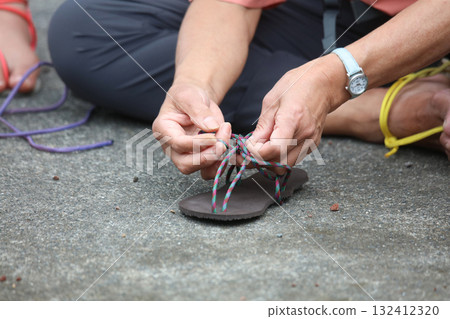 A woman wearing sandals A woman wearing sandals 132412320