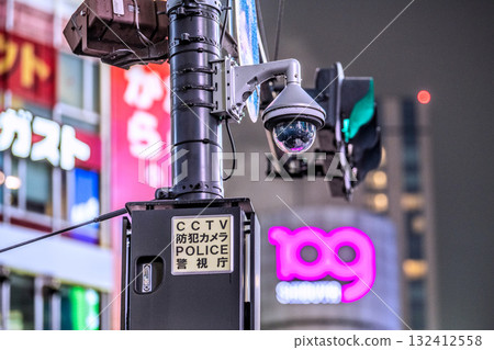 Tokyo cityscape in Japan - Security cameras on street corners. CCTV security cameras at Shibuya Scramble Crossing. POLICE Metropolitan Police Department 132412558