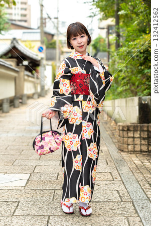 Japanese woman standing on Tenjinzaka Japanese woman standing on Tenjinzaka 132412562