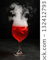 Bubbly red drink with smoke effects served a dark backdrop. 132412793